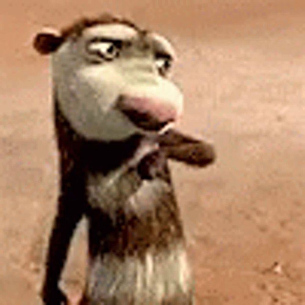 a close up of a cartoon opossum standing on its hind legs on a dirt field .