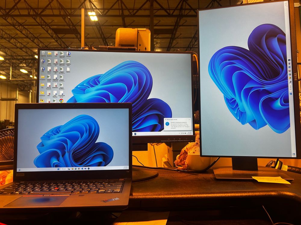 my desk at the warehouse 
there is a new laptop with two other monitors.
i have no idea how this stuff works 