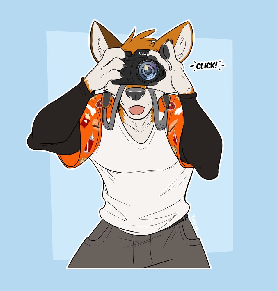 Stanley, an orange wolf with one brown ear, an orange and white t-shirt, and grey shorts, aims a camera at the viewer as he adjusts the lens and snaps a picture. He looks very into it, with his tongue blepping out as he focuses. The camera strap playfully hangs over his snout before coming to a rest around his neck.