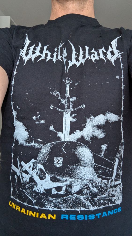Bandshirt of White Ward with impaled skull of russian soldier with Wehrmacht helmet and Z-emblem on it.