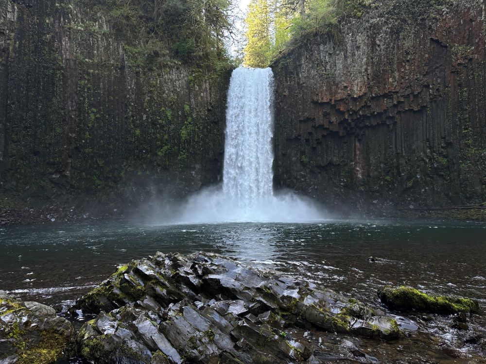 A waterfall cascading over a basalt cliff