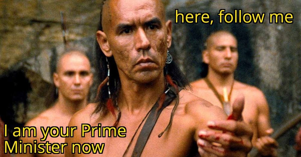 Magua from Last of the Mohicans motioning "come here" with a bloody hand. The captions say "here, follow me, I am your Prime Minister now"
