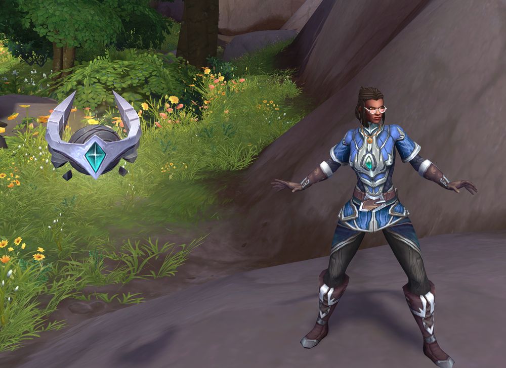 A feminine figure poses with a floating orb contraption next to her.