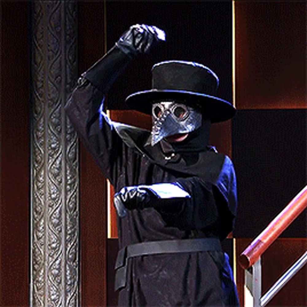 a man in a plague doctor costume with a top hat