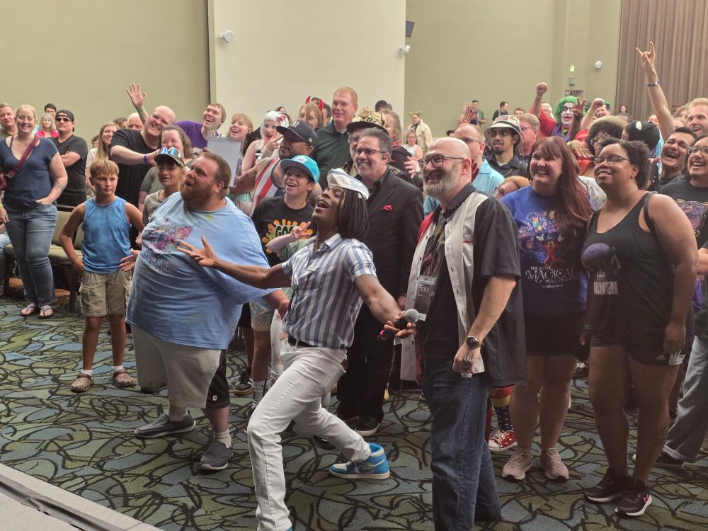 a man poses with an audience