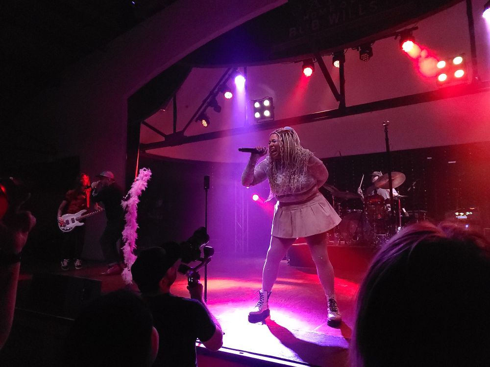 a woman on stage singing