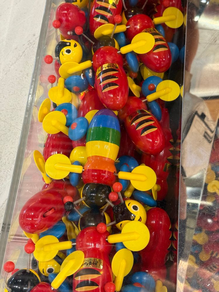 Photo of Buzzy Bee Display at Auckland Airport International Departures, in the shape of NZ - find bees challenge hidden inside the display.

#buzzybee #AucklandAirport #NewZealand #authorlife