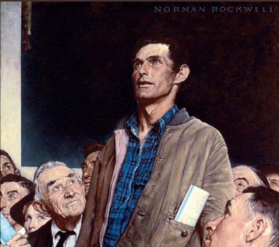 The Norman Rockwell painting, Freedom of Speech, depicts a white man with dark hair in a blue plaid shirt with a brown jacket standing up as if he is about to say something. The other people in the room look up at him from their seats.