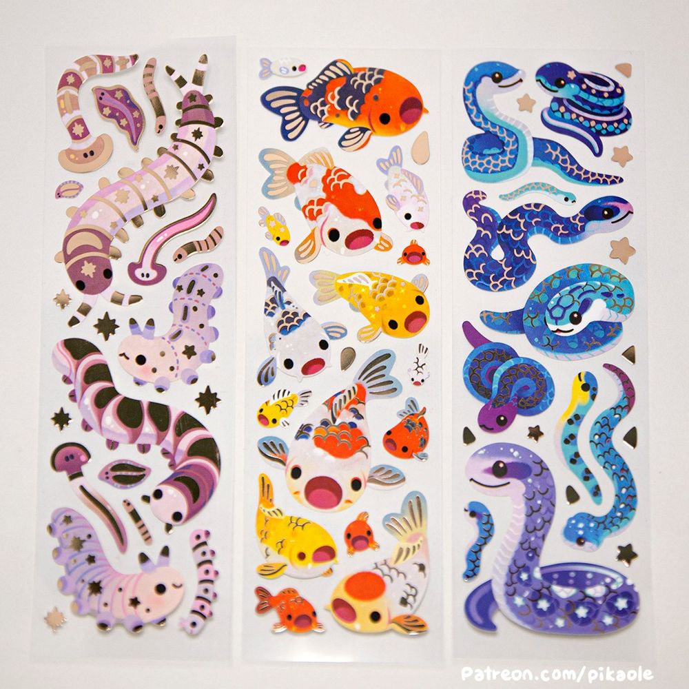 There are stickers of long worms, koi, and blue snakes. They are decorated with foil. All are designed based on real animals.