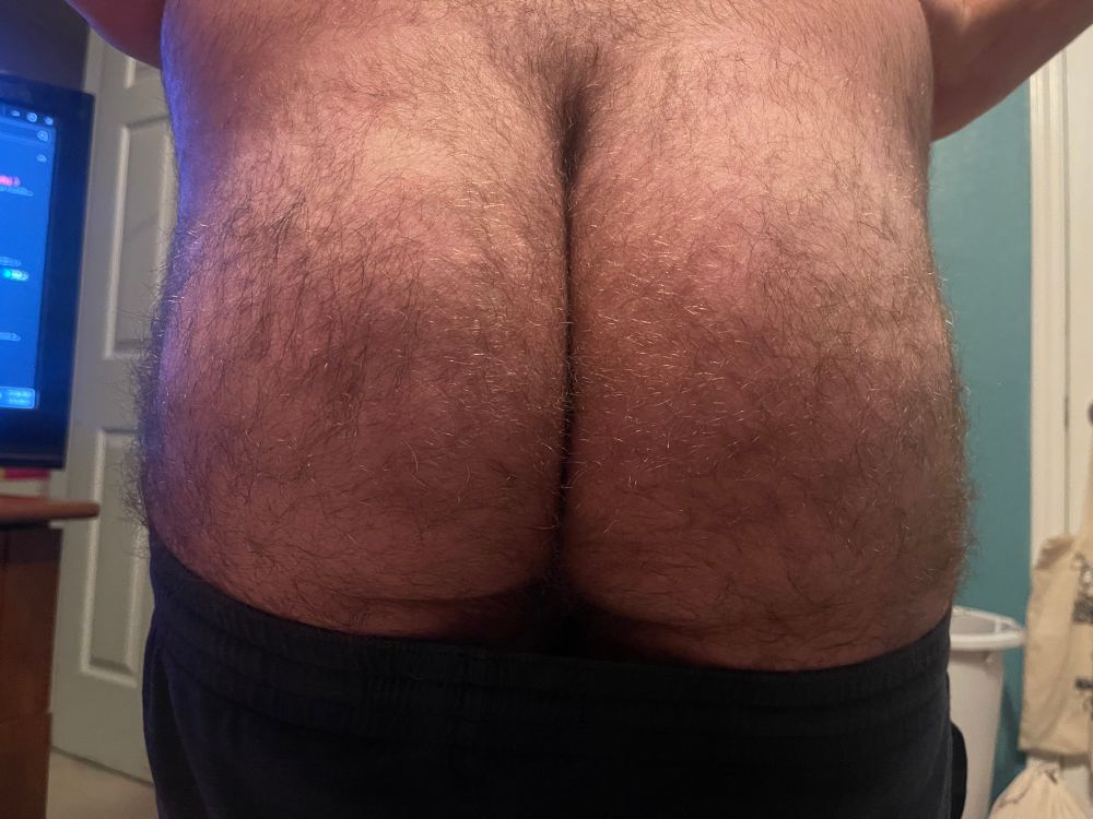 Front angle of my exposed ass, my shorts pulled down at my thighs