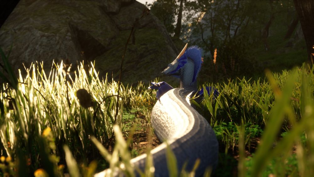 A screenshot of a silver scaled Lindwyrm with blue fins slithering in glass on Draconia.