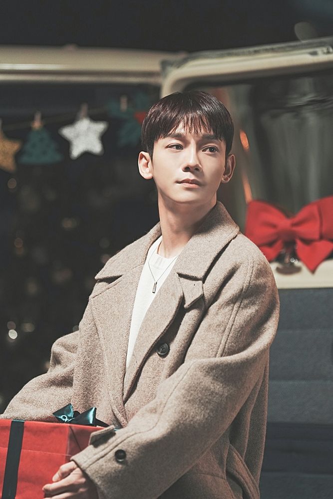 EXO Chen holding a present/gift while looking wistfully to somewhere off-camera