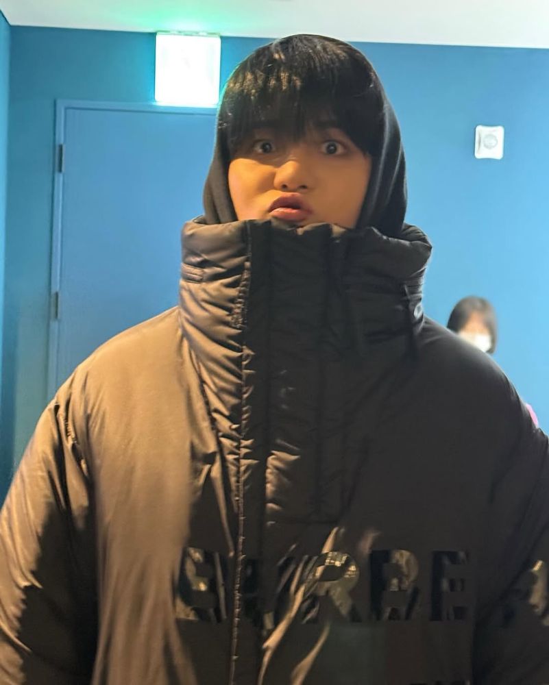 ATEEZ Jongho in a big winter coat, looking cute