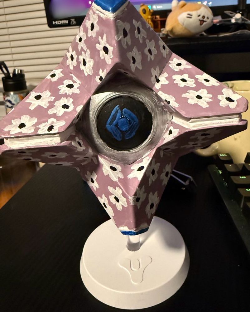 A ghost from the video game Destiny painted purple with white flowers