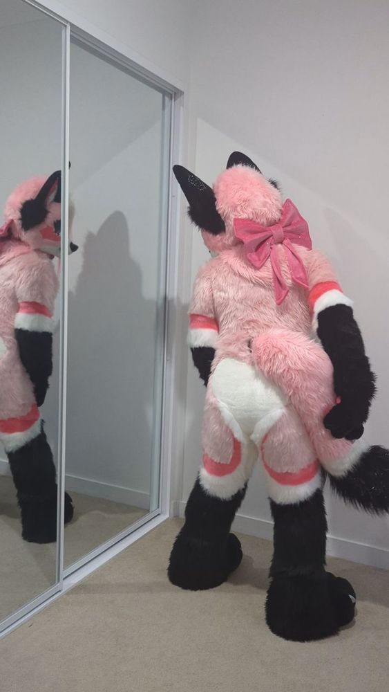 Pink fox fursuit 
