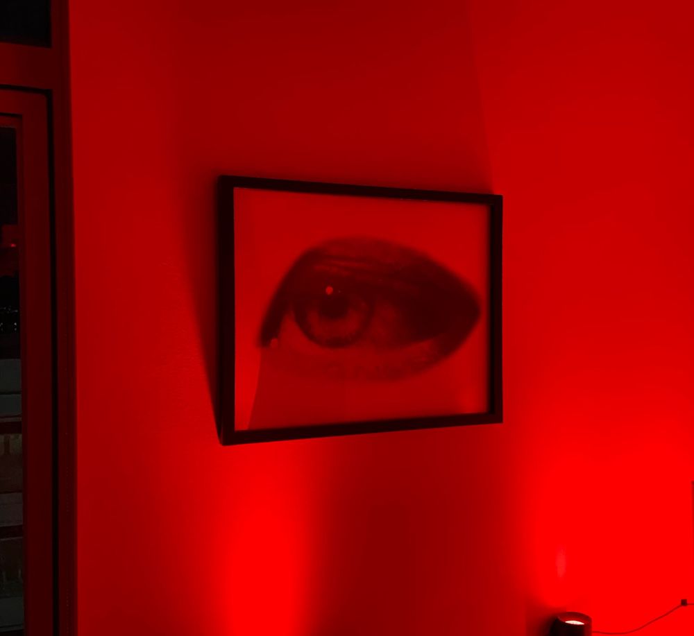 The print in red light showing an open eye