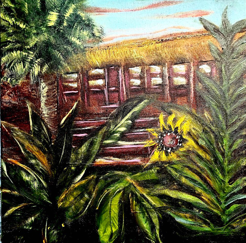 Painting of a small red-brown bungalow in the setting warm sunlight, reflected in the row of windows across the front of the shack. Sandy steps lower down into lush greenery below with a large Brown-eyed Susan staged to the left of the house in the foliage. A tall fat palm tree rises to the right to extend over the thatched roof. Light blue sky with thin line of clouds above catch the pink orange sunset. 