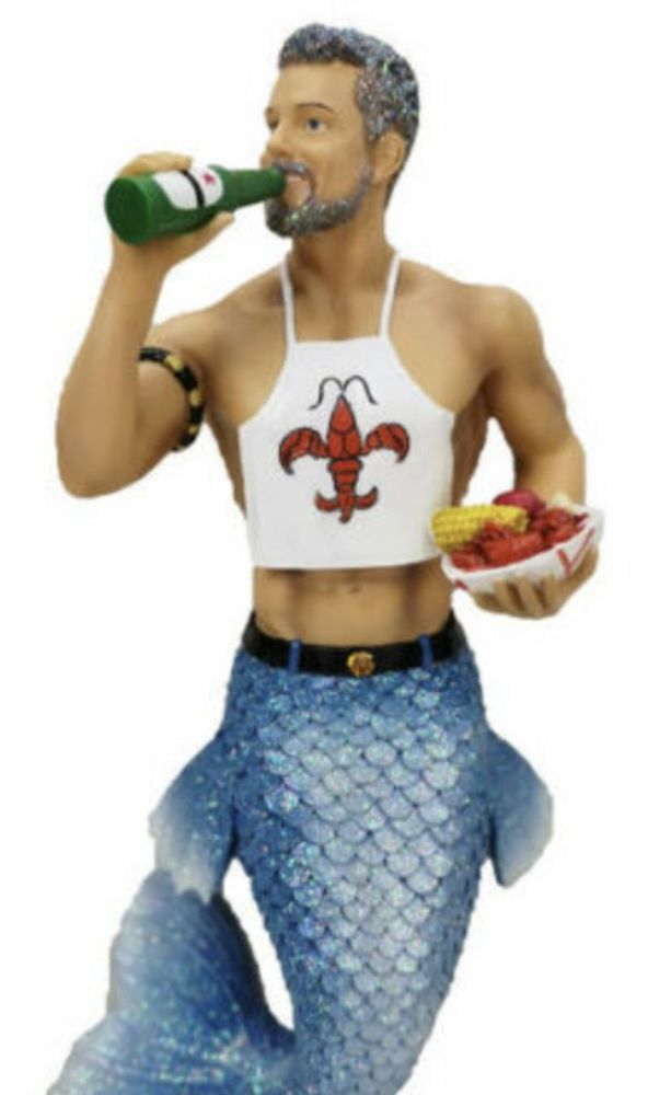 A statue of a merman in a crawfish bib