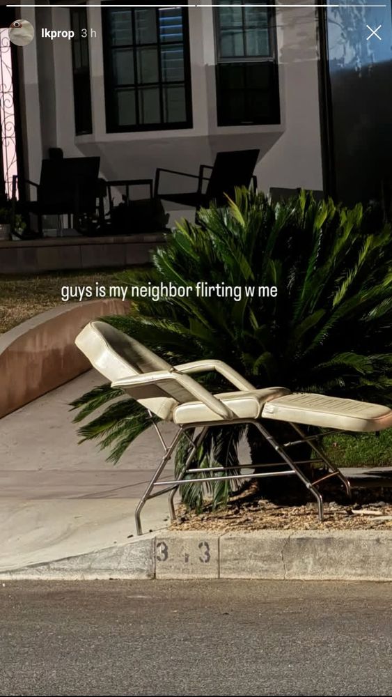 an insta story from lkprop laura of what appears to be a recliner chair abandoned on the sidewalk with the caption "guys is my neighbor flirting w me"
on the edge of the street curb the numbers 3 3 are visible 