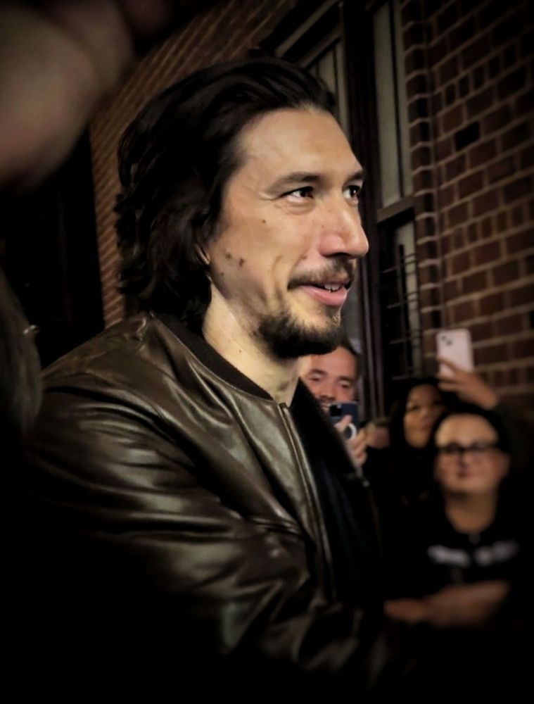 Adam Driver smiling at the stage door of Hold On To Me Darling