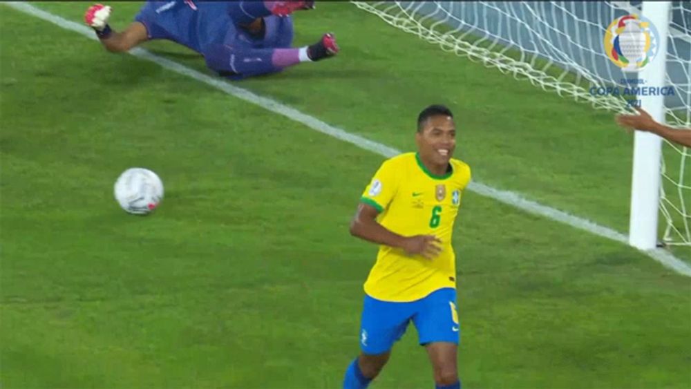 a soccer player in a yellow shirt with the number 6 on it