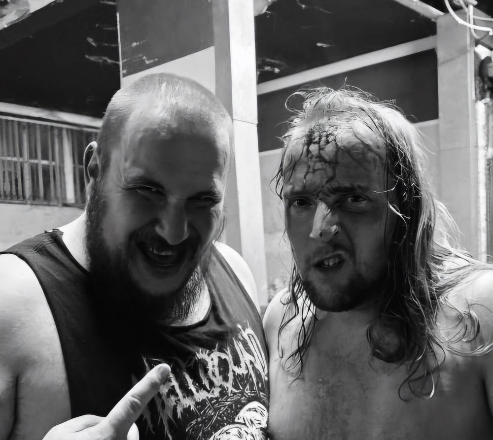 Alton Thorne stood next to Brad Matthews, who has blood trickling down his forehead.