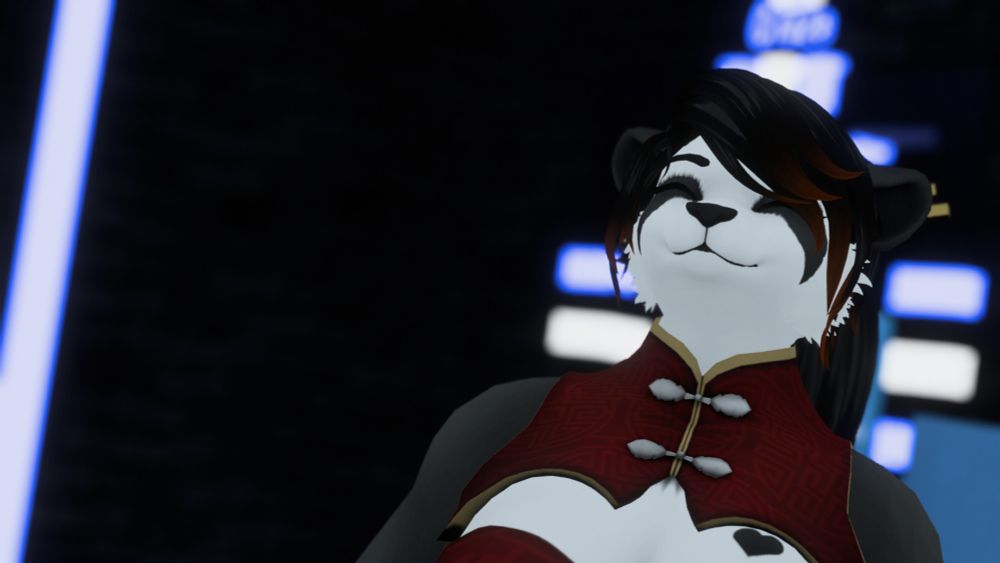 A photograph from within VRChat. The main focus is panda wearing some red clothing. The background is a club setting with bright lights.