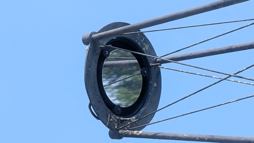 The focusing mirror sits in place at the end of a long boom arm and concentrates the sun’s rays into the main observatory to form an image.