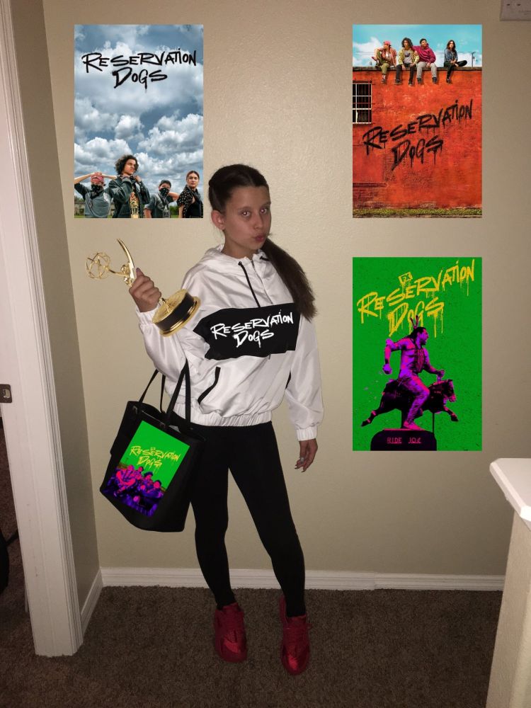 "Fangirl" meme with Reservation Dogs posters surrounding her and an Emmy in her hand