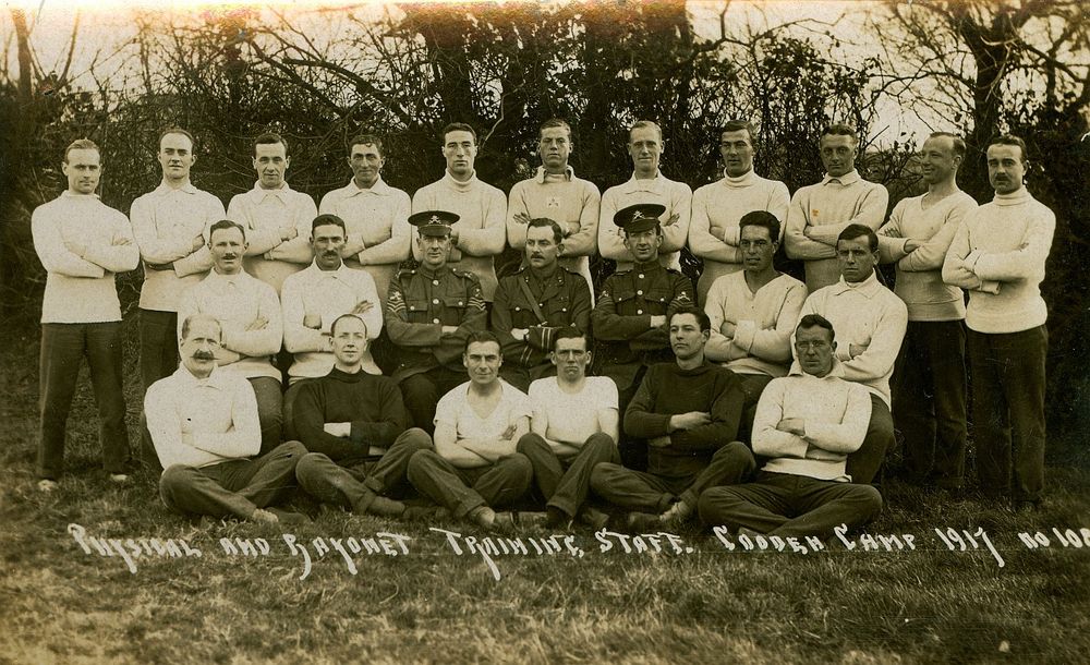 Black and white photograph as a postcard. "Physical And Bayonet Staff. Cooden Camp 1917." First World War.