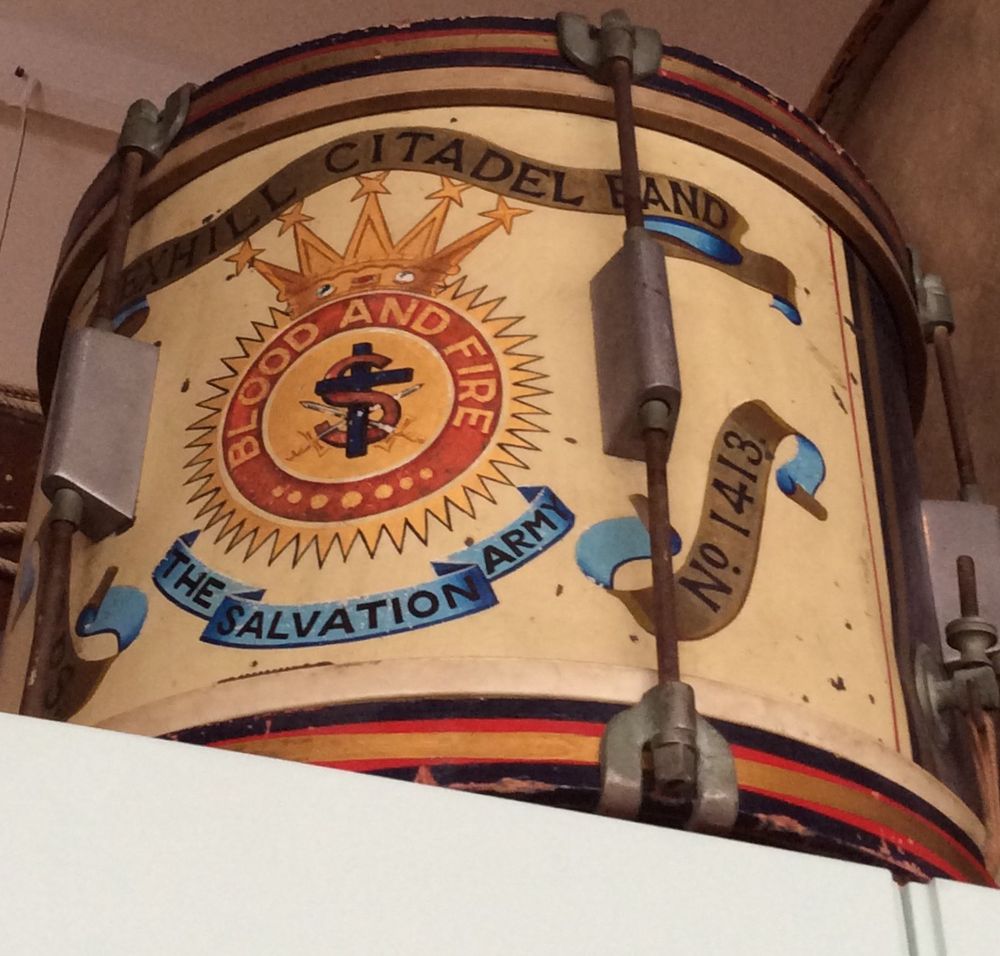 This is the side of the drum when it is flat. It says “Bexhill Citadel Band. Blood and Fire. The Salvation Army. No. 1413.”