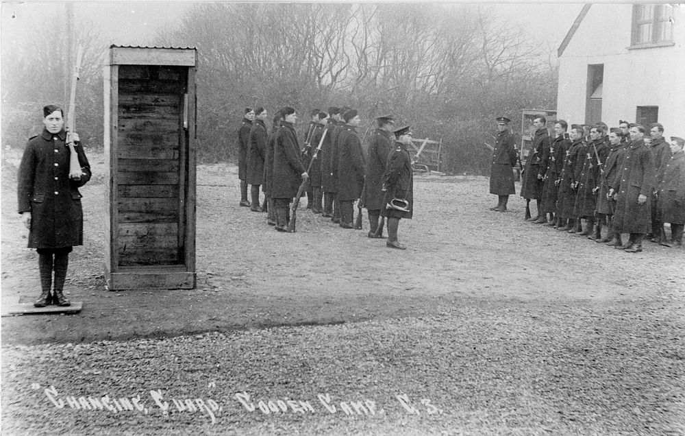 Black and white photograph as a postcard. ""Changing Guard," Cooden Camp." c.1918.