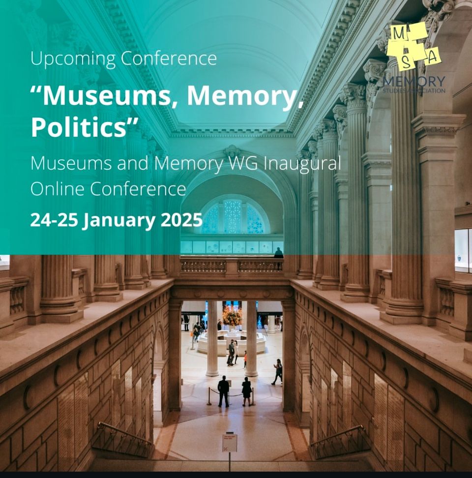 View down a stone staircase that classical pillars on each side with a partial view through a doorway into a room of exhibitions. The top half of the image is partially covered with information about the conference, which can be found in the link.