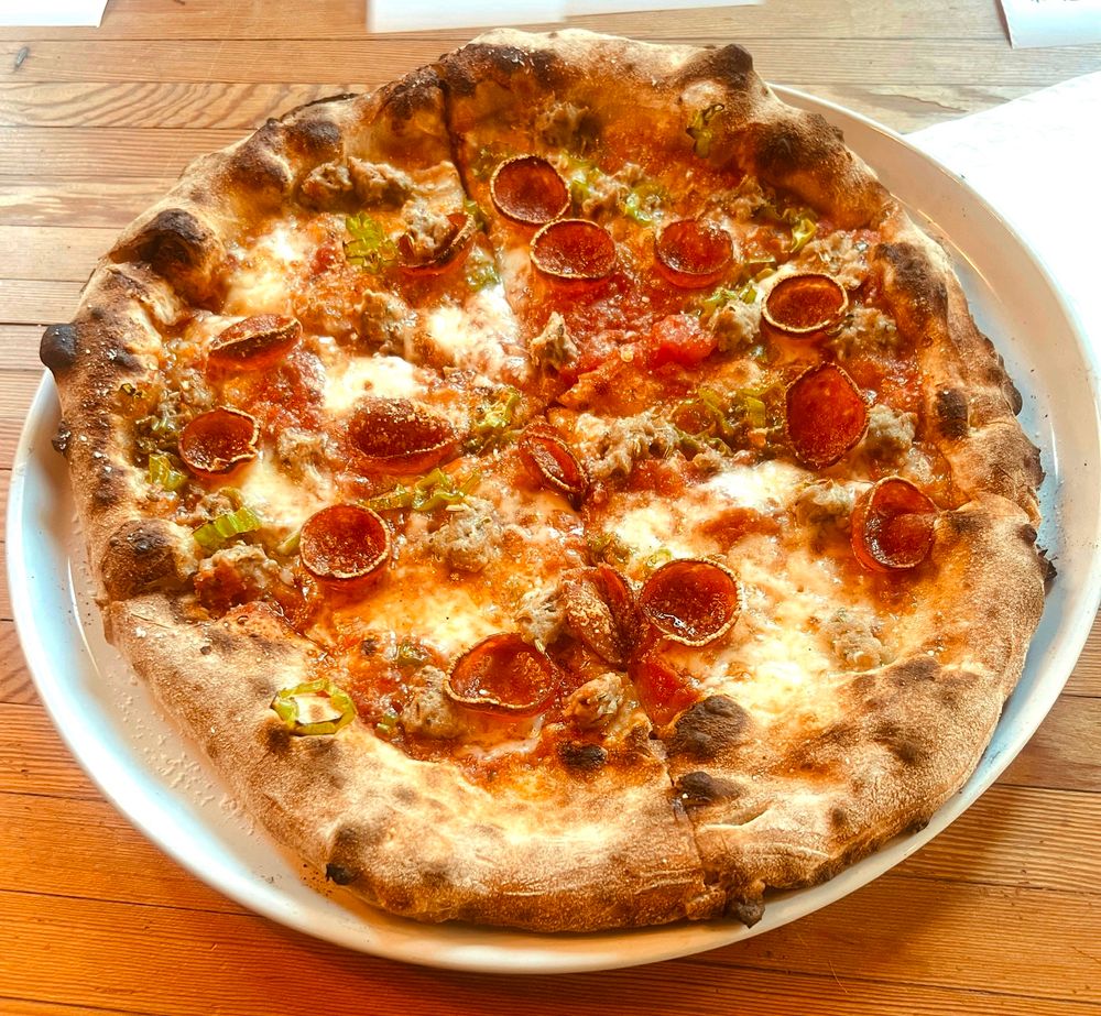 a sausage and shishito pizza from carlson block