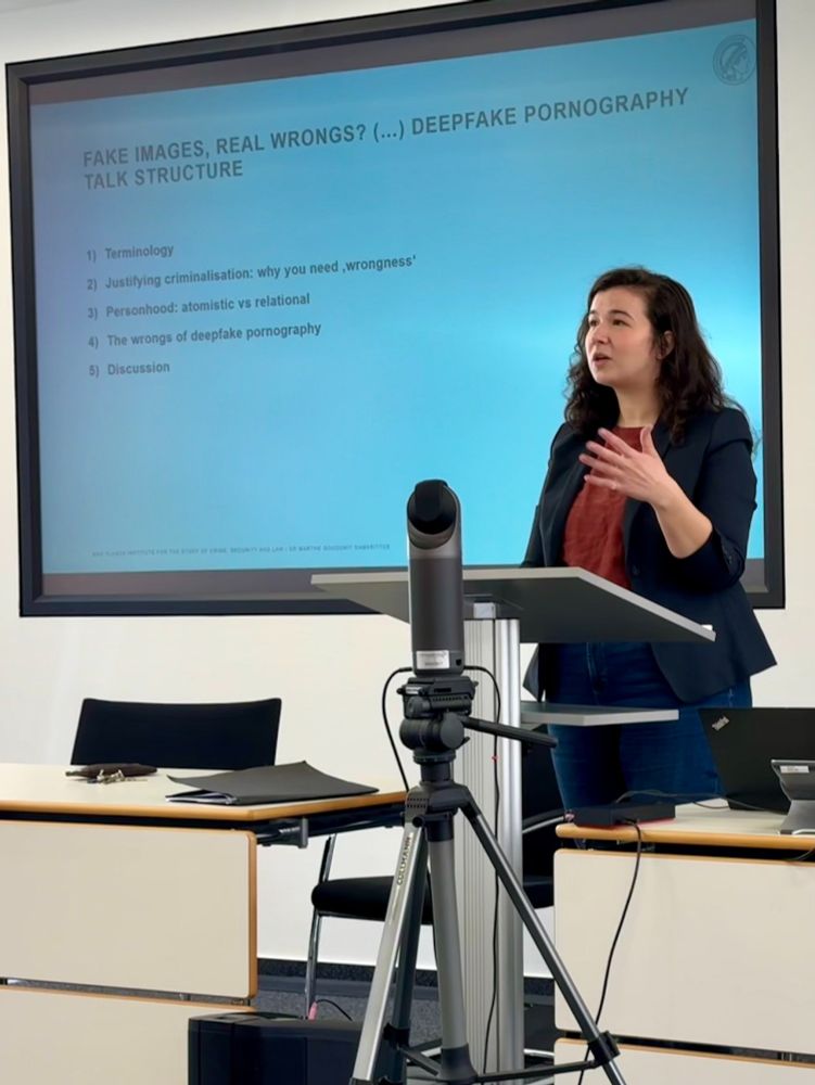 presenter in front of slide reading 'real images, fake wrongs?'