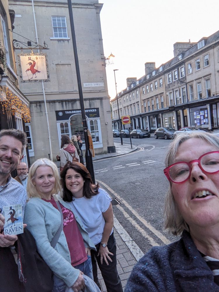 A four person selfie taken outside the Raven Pub in Bath. Evening light.