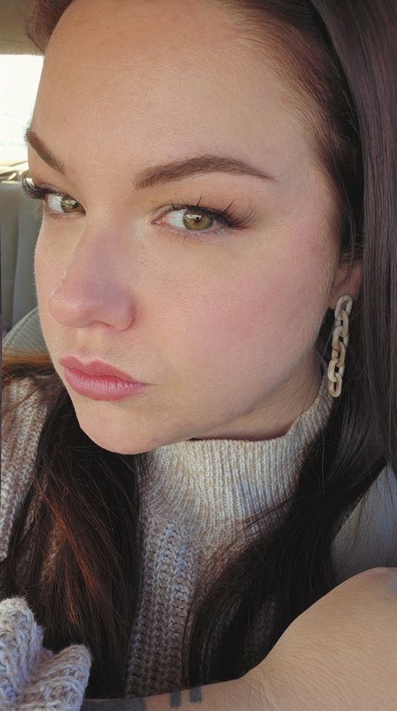 Op, a generic middle-aged white woman with brown hair looks at the camera 