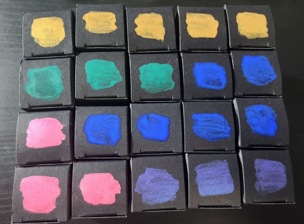 Black boxes filled with ink labeled by ink swatches