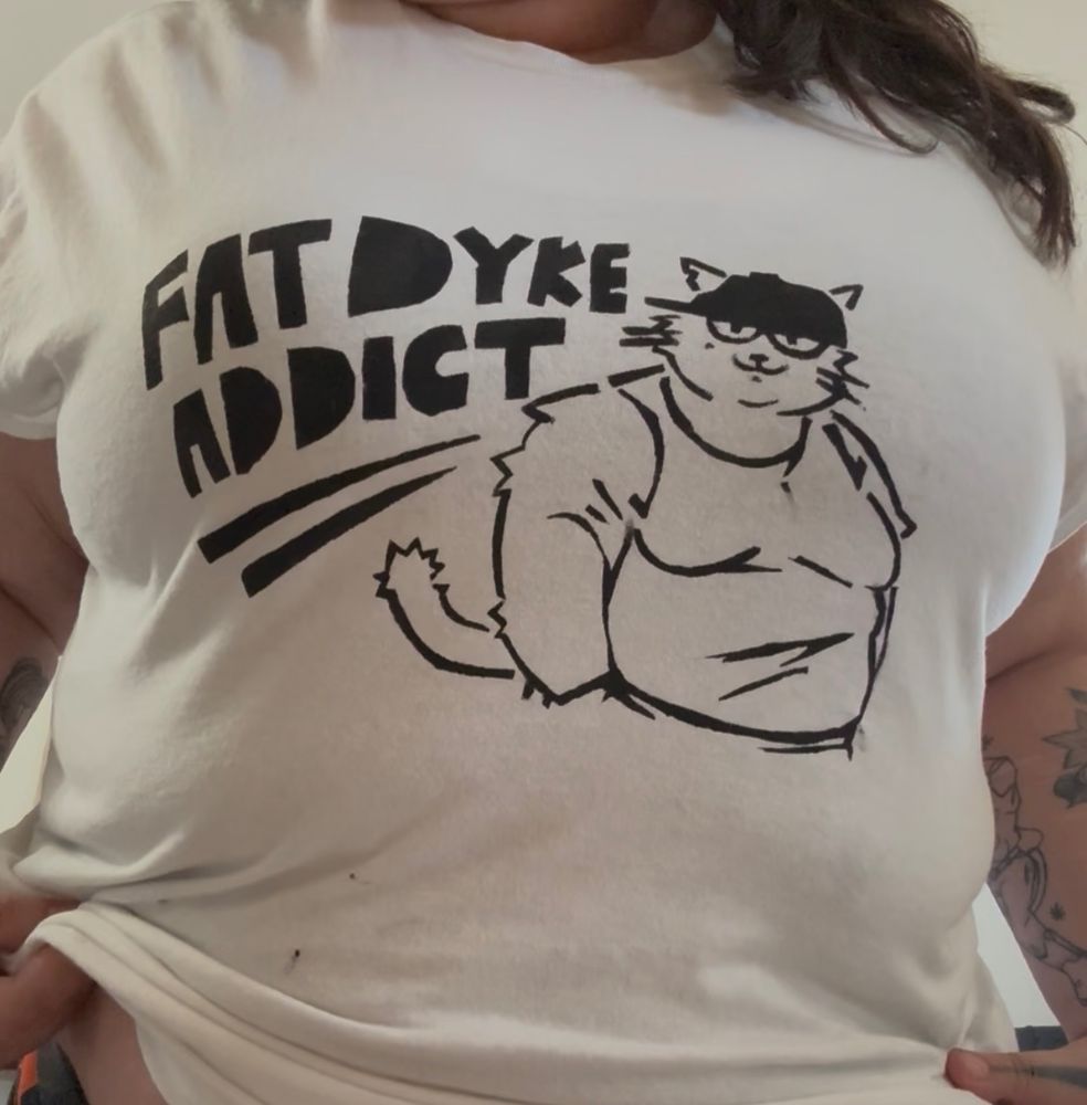 shirt of Fat dyke addict" with lineart of a fat cat anthro with a baseball hat