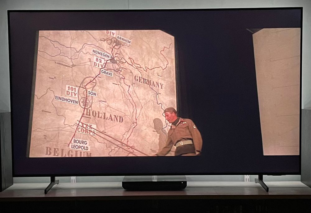 Edward Fox as Lt. Gen. Horrocks in front of huge map of Holland pointing at where his troops are going during Operation Market Garden.