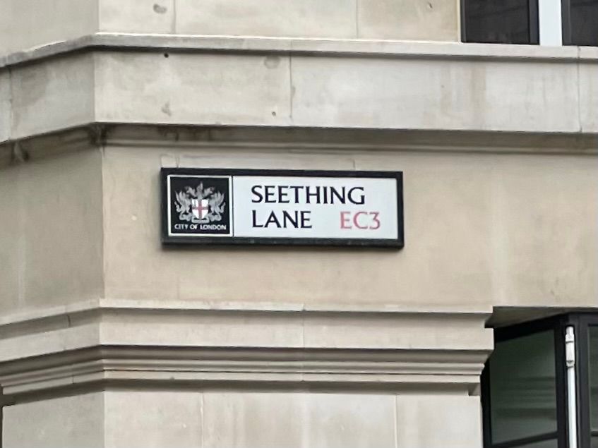 City of London street sign, black lettering on white, reading “SEETHING LANE”