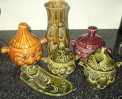 A collection of whimsical pottery vessels for Onions, Cucumber, Celery, Mint Sauce, Beetroot and Apple Sauce.