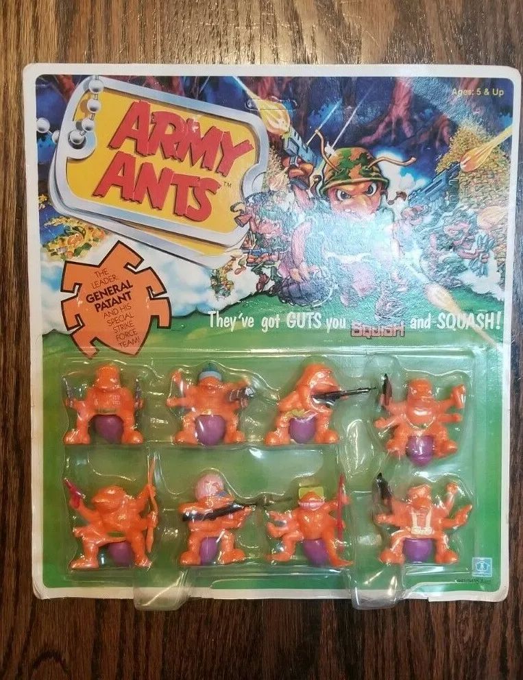 Picture of a sealed package of Army Ants actions figures. The ants are orange and have purple butts. Many are holding guns. 
