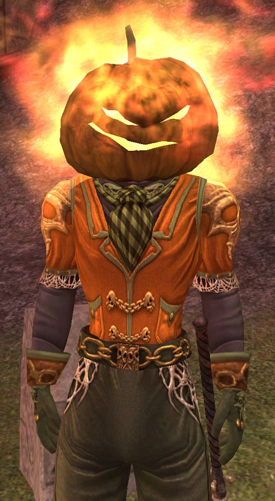 Screenshot from a video game. Humanoid character in an orange and green outfit wears a pumpkin mask on their head. 