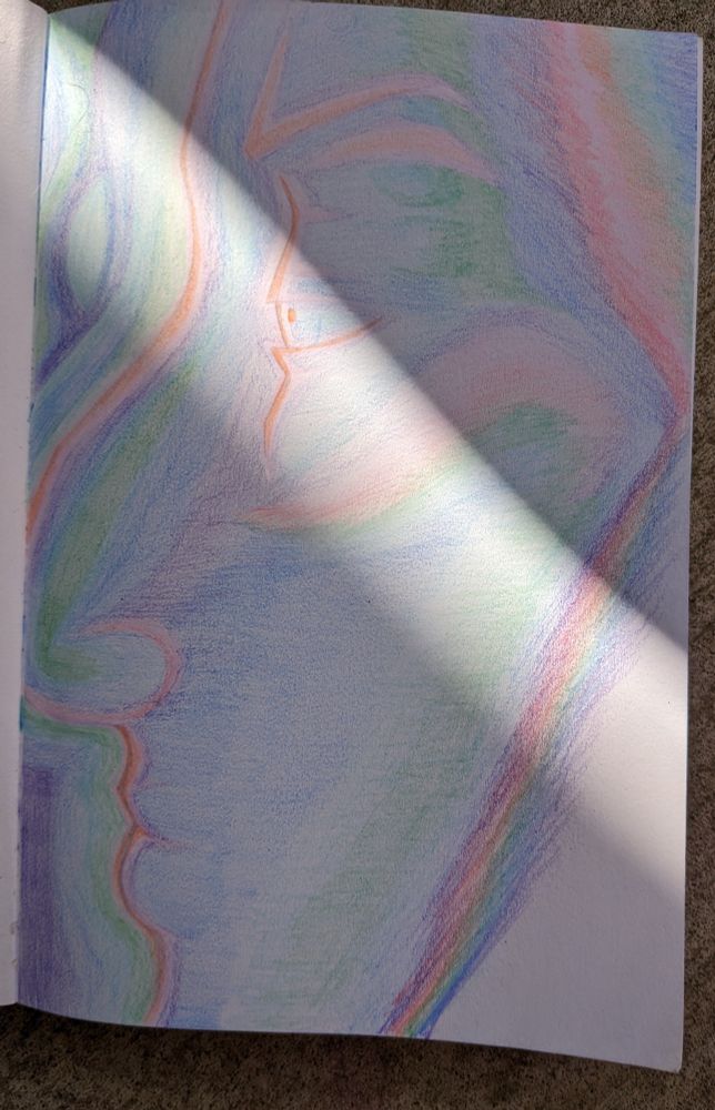 sketch done with colored pencils of a face in profile