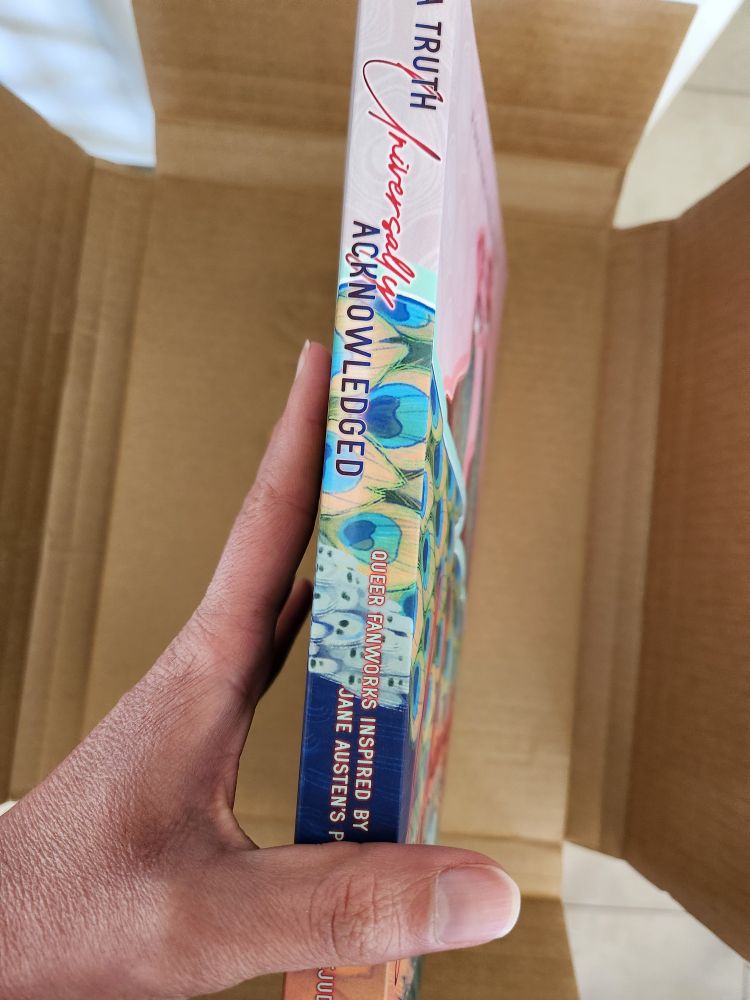 A view of the spine of A Truth Universally Acknowledged, which is THICK.