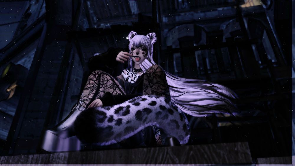 Character from FFXIV that is modded to be a miqo'te variant snow leopard. She has long lilac hair and is in a black romper, lace tights, and platform boots. She is sticking out her tongue with her hand pulling on her mouth to pull it open. 