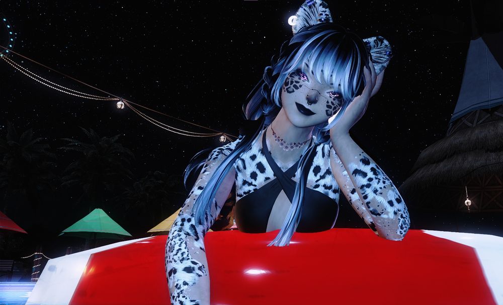 Ray with her hair dyed primarily black with lavender tips. She's handing on the side of a red and right floaty while sporting a black bikini. She's got a smirk on her painted black lips as she looks down at the presumed OC that she just splashed with water. Her head is quirked at a 80 degree angle while resting against her hand. Her other arm is resting over the side of the circle floaty with her hand resting in the water.