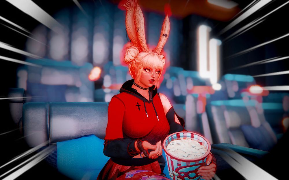 Ayashi sitting in a theater, popcorn bucket in hand and in awe at what she is seeing on the silver screen. Behind her are rows of other chairs and action lines pointing towards her