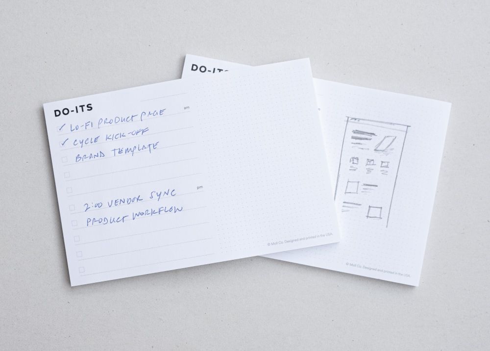 Do-Its pads showing handwritten tasks and a UI sketch